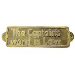Brass plaque bearing The Captains Word is Law, 7 1/2'' long Please Note - we do not make reference