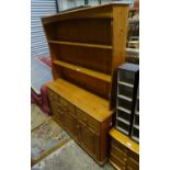 A late 20thC pine dresser. Approx. 69 1/4" tall Please Note - we do not make reference to the