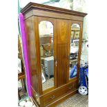 An early / mid 20thC mahogany wardrobe with checkered inlay, marquetry detailing and two mirrored