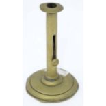 A brass chamberstick Please Note - we do not make reference to the condition of lots within