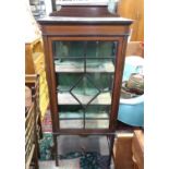 An Edwardian glazed display cabinet. Approx. 60" high Please Note - we do not make reference to