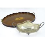 A silver plated fruit bowl with glass liner together with an inlaid oval butler?s tray with brass