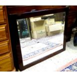 A mahogany framed bevelled edge mirror. 33 /14" tall Please Note - we do not make reference to the