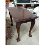 Side table with serpentine top and ball and claw feet. Approx. 38" wide Please Note - we do not make