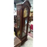 A large American longcase clock. Approx. 80" tall Please Note - we do not make reference to the