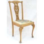 A 20thC stripped dining chair with upholstered seat. Approx. 39" tall Please Note - we do not make
