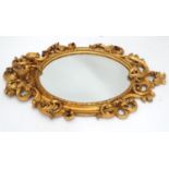 A gilt mirror with cherub detail. Approx. 35 1/2" long Please Note - we do not make reference to the