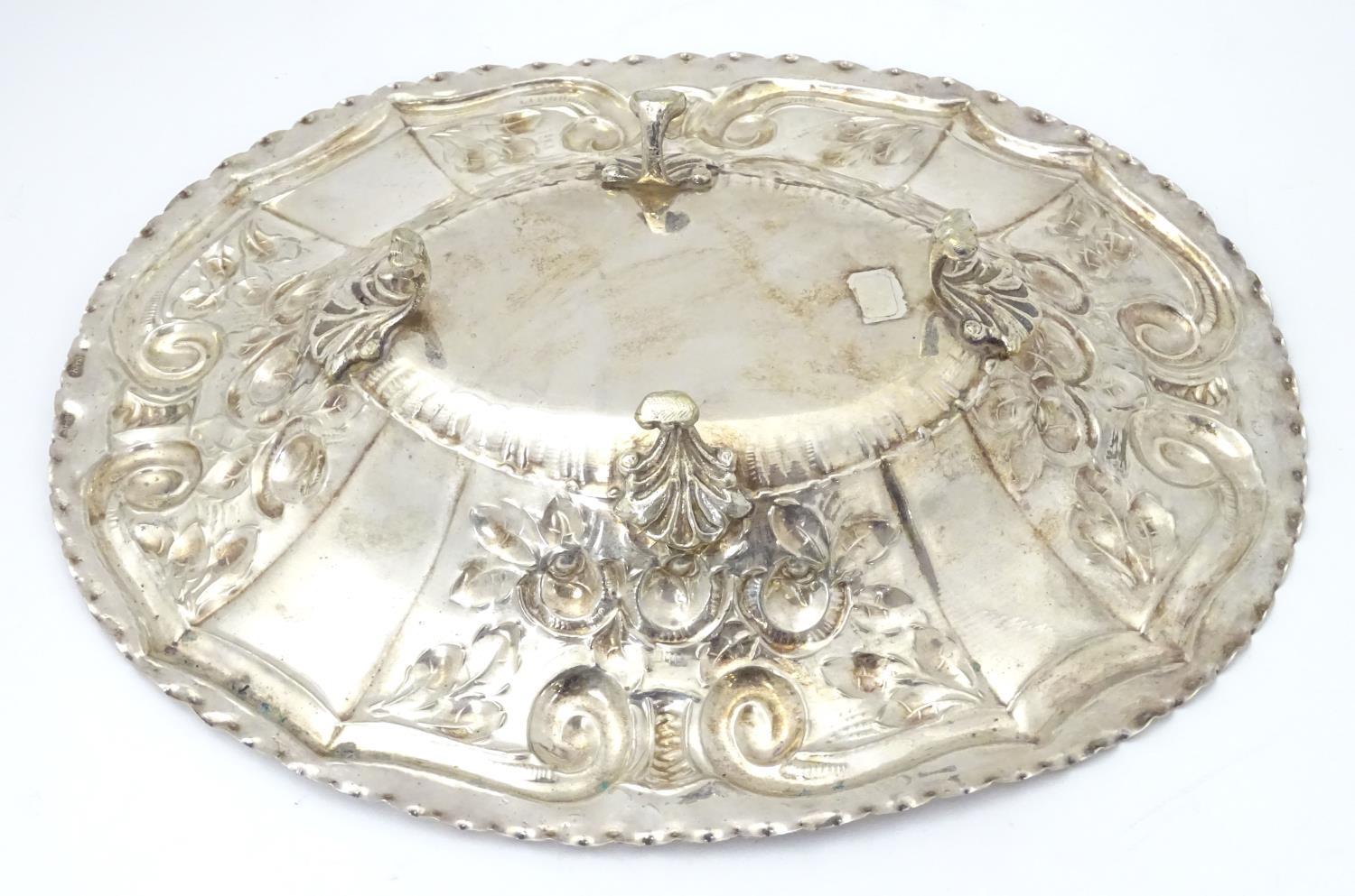 A silver plate dish of oval form with embossed decoration. Approx. 12" wide. Please Note - we do not - Image 5 of 5