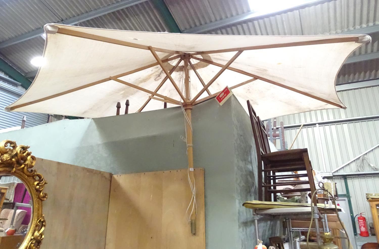 A large parasol. Approx. 7ft wide Please Note - we do not make reference to the condition of lots - Image 3 of 3