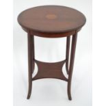 A small circular inlaid table. Approx. 27 1/2" tall Please Note - we do not make reference to the