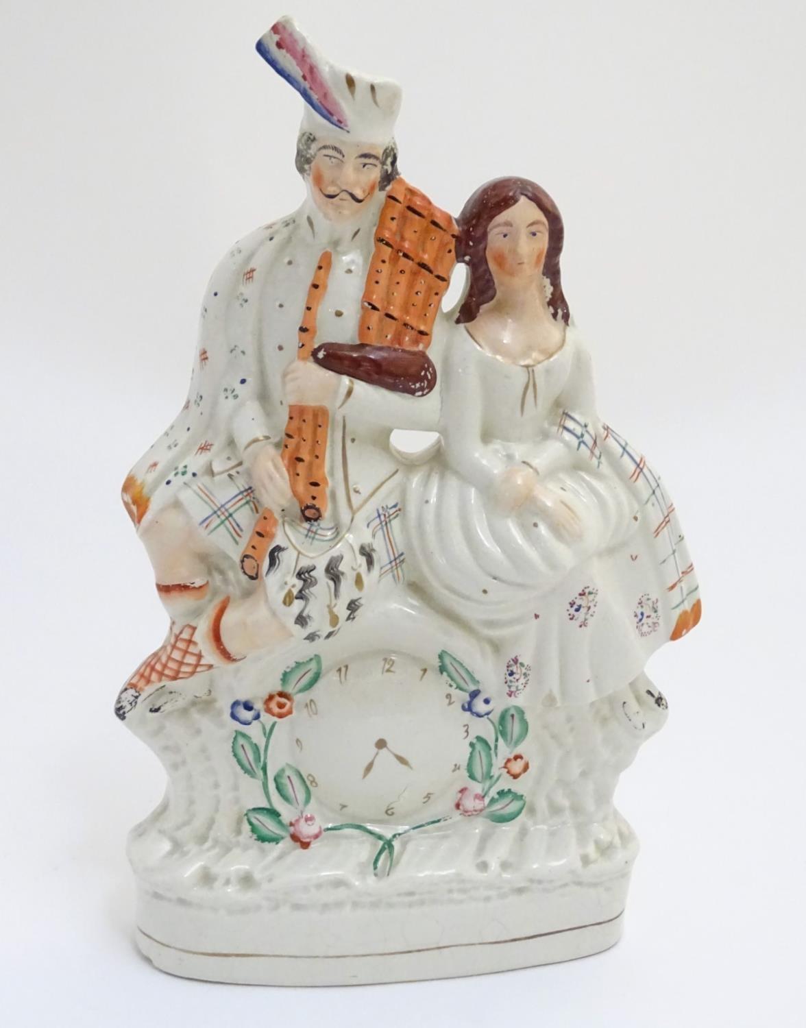 A 19thC Staffordshire flatback figural group of Bonnie Prince Charlie and Flora Macdonald seated