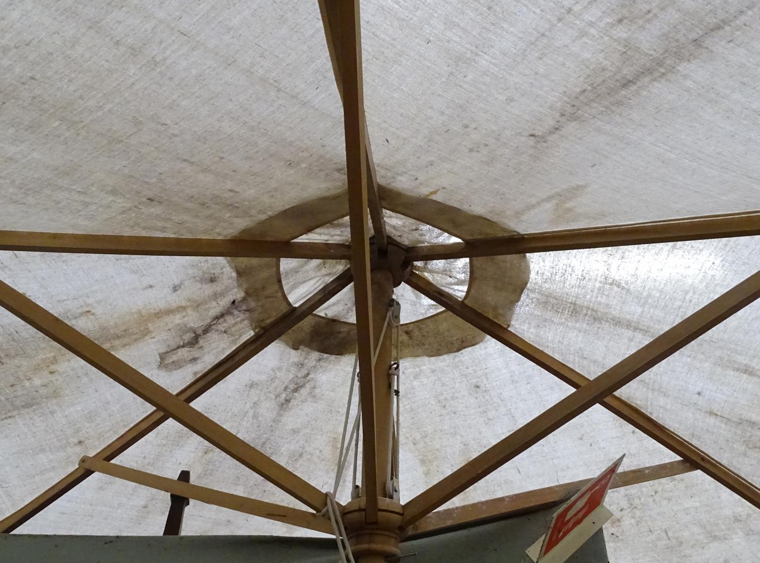 A large parasol. Approx. 7ft wide Please Note - we do not make reference to the condition of lots - Image 2 of 3