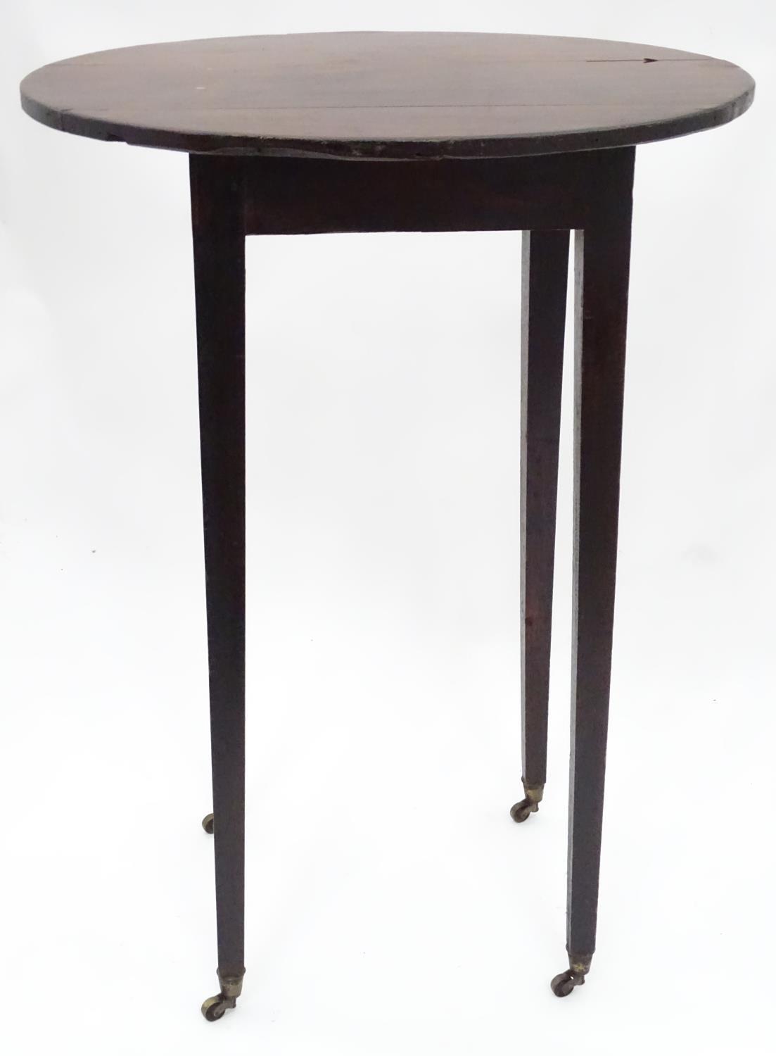 A 19thC mahogany oval occasional table. Approx. 27" tall Please Note - we do not make reference to - Image 3 of 7