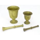 A pestle and mortar, together with another. The largest approx. 7 1/4" tall (2) Please Note - we