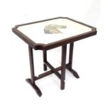 A gateleg drop flap occasional table, the top inlaid with needlework depicting a dog. Approx. 29 1/