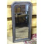 A bevelled edge mirror in an ebonised frame. Approx. 39 3/4" tall Please Note - we do not make