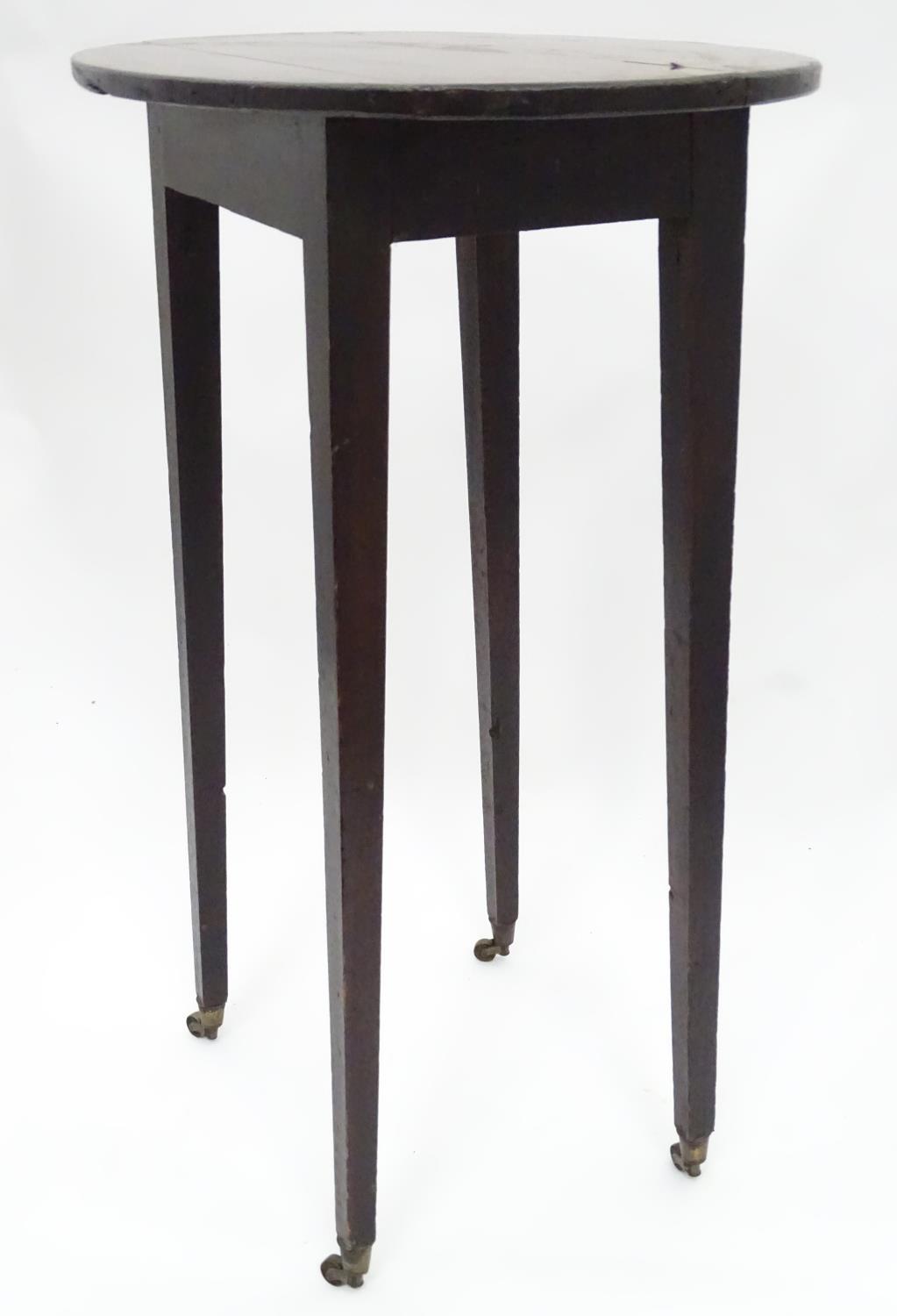 A 19thC mahogany oval occasional table. Approx. 27" tall Please Note - we do not make reference to - Image 4 of 7