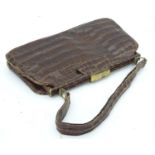 A vintage crocodile handbag with purse and mirror Please Note - we do not make reference to the