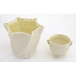 Two Belleek Ireland pottery wares, comprising a twisted lustre shell vase / flower pot with a