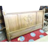 A carved oak bed headboard Please Note - we do not make reference to the condition of lots within