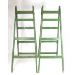 Salvage & Architectural Antiques: two c1940s large industrial step ladders, in green painted