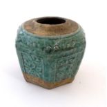 A Chinese hexagonal Shiwan ginger jar / vase with moulded floral and foliate detail with a blue /