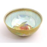 A Wedgwood lustre ware bowl with hand painted fruit decoration with gilt highlights. Approx. 2 1/
