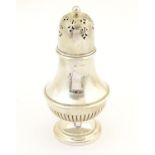 A silver sugar caster hallmarked Birmingham 1915. Approx. 6 1/2" high Please Note - we do not make