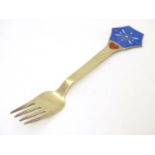 A Danish sterling silver gilt and enamel 1976 Christmas fork with Snow Crystal design. Maker A.