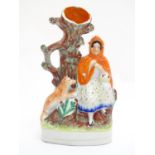 A Staffordshire flatback bud vase depicting Little Red Riding Hood in a woodland scene with a