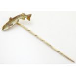 A 9ct gold stick pin surmounted by a model of a fish, maker A&W. Approx. 2 1/2" long overall