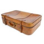 A vintage leather suitcase with carry handle and zip and buckle fasteners. Approx. 16 1/2" x 26" x 7