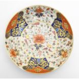 A 19thC Derby dish with hand painted floral and foliate detail in the Imari palette. Marked under.