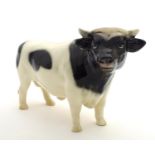 A Coopercraft Friesian bull in the manner of Beswick. Marked Made in England under. Approx. 6 1/4"