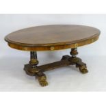 A Regency double pedestal table in the style of George Bullock, with an oval rosewood top