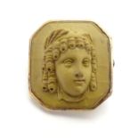 A 19thC lava Grand Tour style cameo brooch within a gilt metal mount. Approx. 7/8" high Please