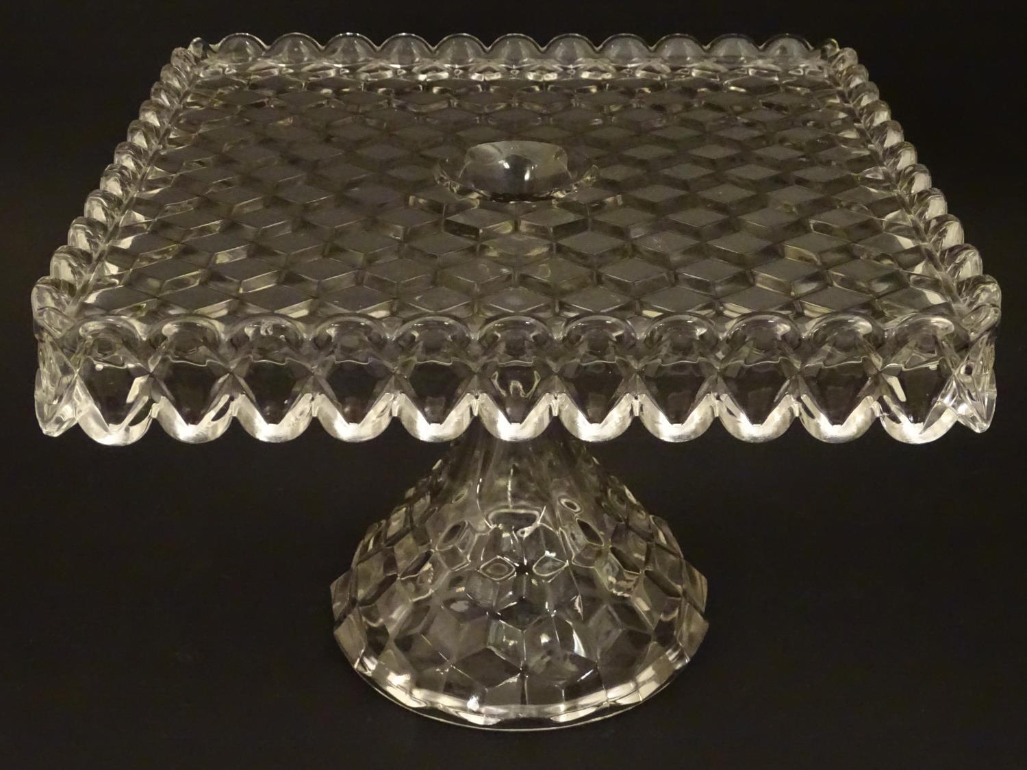 A vintage American Fostoria cube glass tazza / cake stand with squared top. 7 1/4"high x 10" high