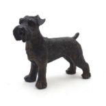 A 20thC cast model of a dog, possibly a schnauzer. Approx. 4" high Please Note - we do not make