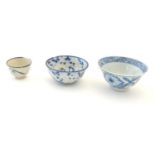 Three assorted Oriental blue and white wares to include saki cup, tea bowls etc. Character marks