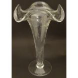 A clear glass vase with flared rim and circular foot. 14" high overall Please Note - we do not