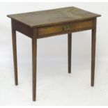 A late 18thC / early 19thC oak side table with a rectangular top above a single long drawer with