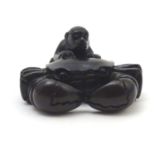 A Japanese carved netsuke modelled as a large crab and monkey. Character marks under. Approx. 1"