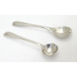 A small silver mustard spoon and salt spoon. hallmarked Birmingham 1932 maker William Neale & Son