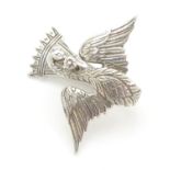 A silver napkin holder with brooch pin a bird decoration. Hallmarked London 1932 maker HAL and rd.