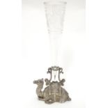 A Victorian silver plate epergne, the base formed as a recumbent camel with clear glass flute to
