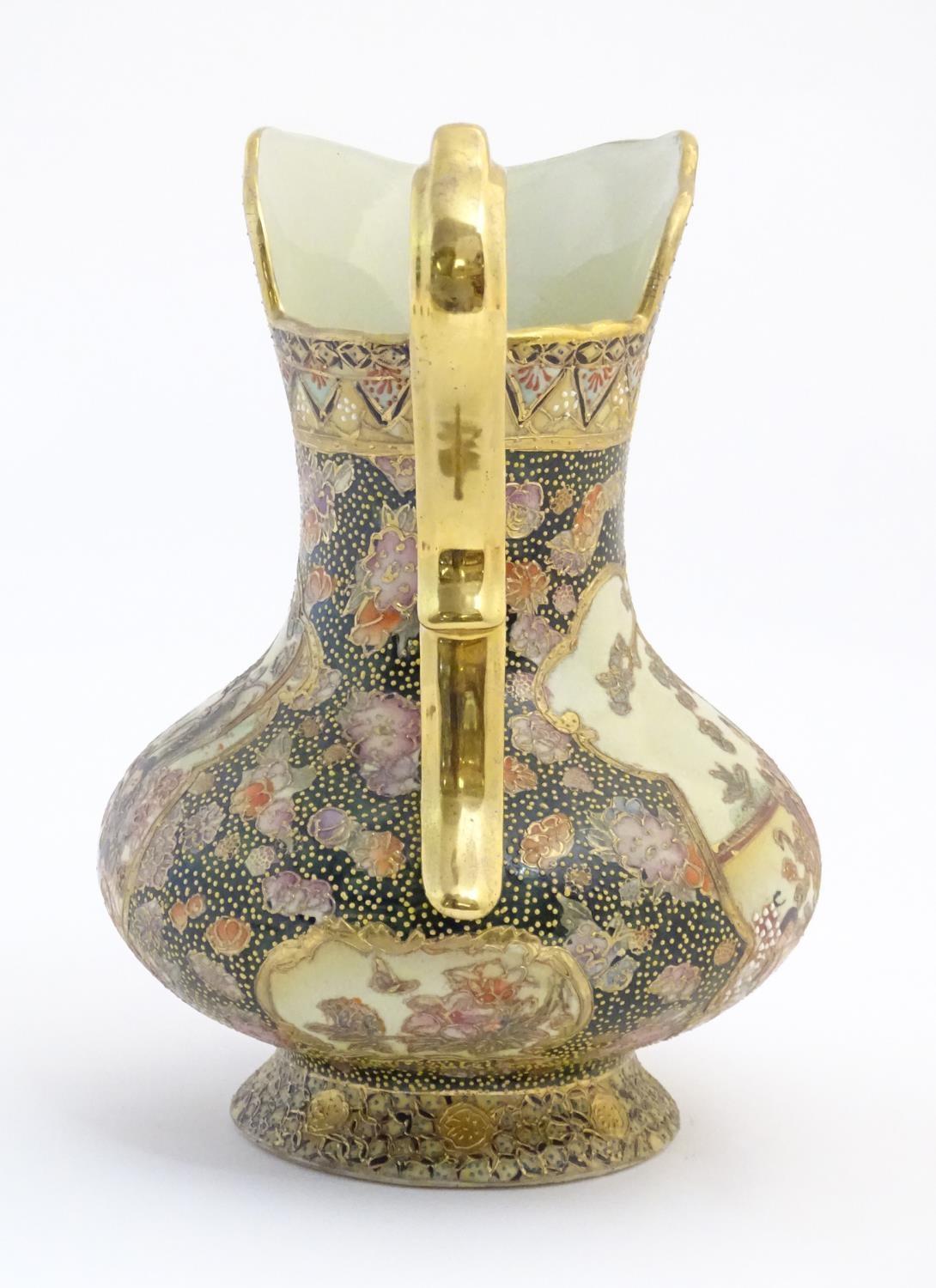 An Oriental jug / ewer with a bulbous body decorated with panels depicting ladies in a garden - Image 3 of 8