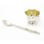 A silver egg cup and spoon hallmarked Sheffield 2004 maker Carrs of Sheffield. The spoon 5" long