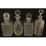 4 assorted cut glass decanters. The tallest 10 3/4" high Please Note - we do not make reference to