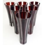 A set of 6 late 20thC bohemian red glass champagne flutes. Approx 6" high Please Note - we do not