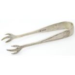 Silver sugar tongs with bird?s claw form grips. Hallmarked Sheffield 1928 maker Cooper Brothers &